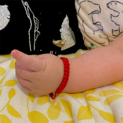 Red baby bracelet for the evil eye