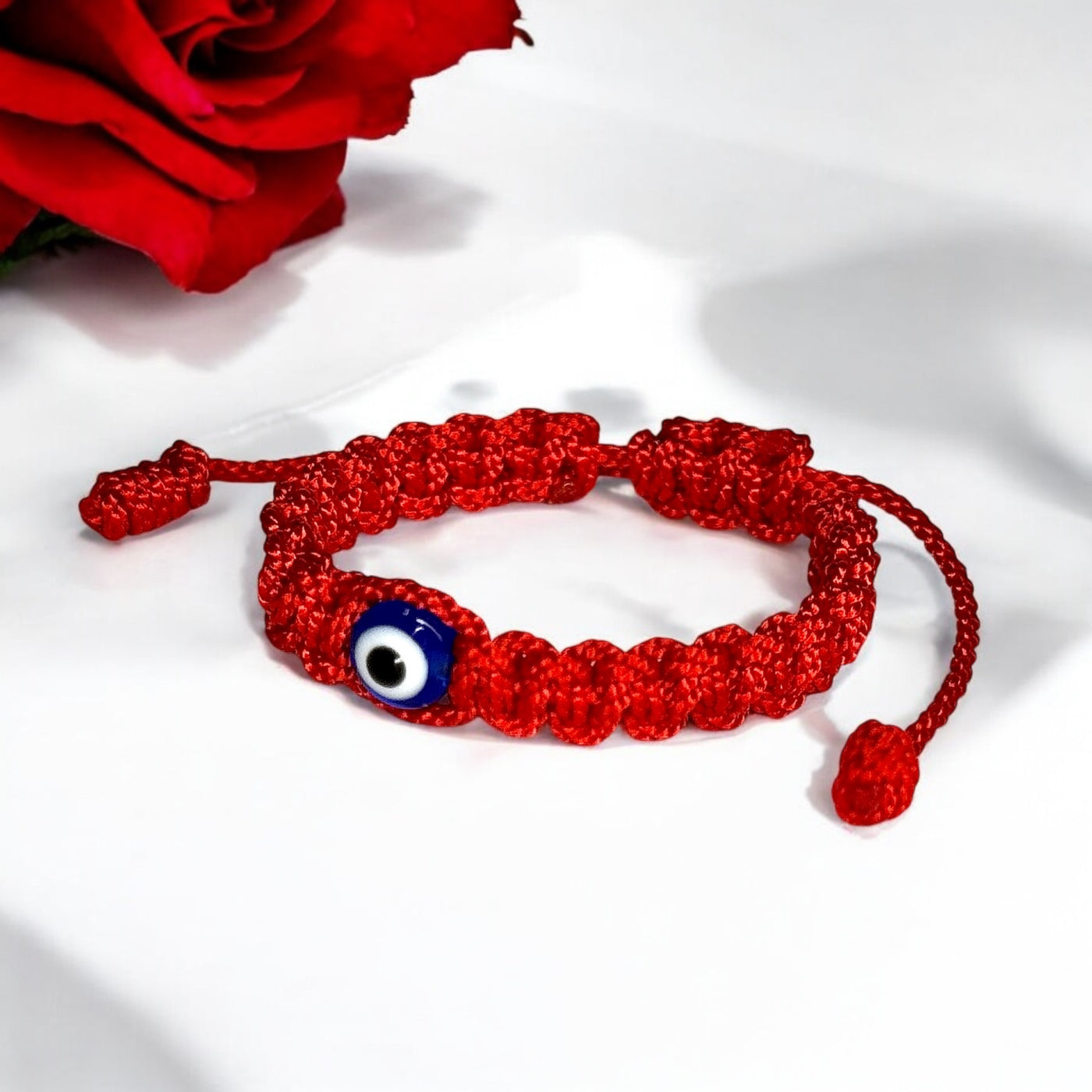 red baby evil eye bracelet with blue eye