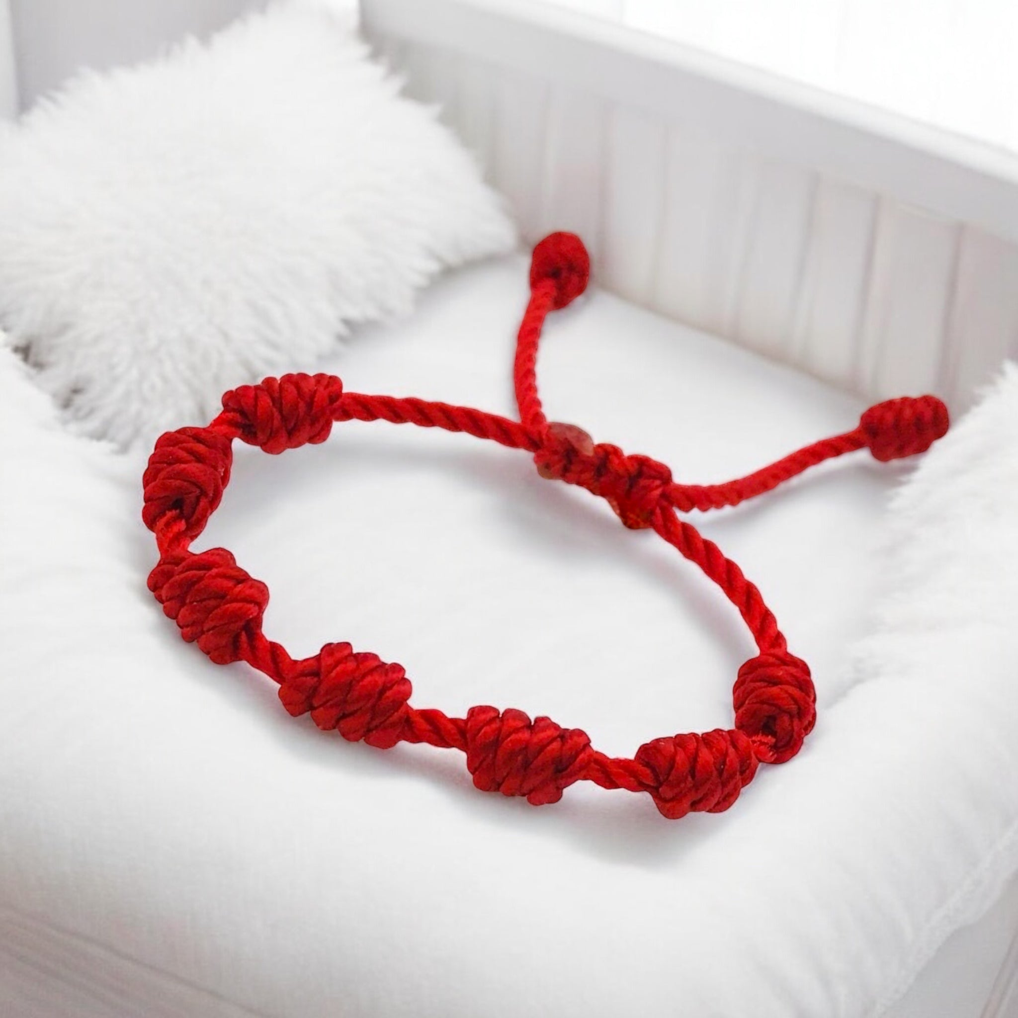 red baby bracelet for the evil eye 7 knots